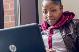 student with a laptop